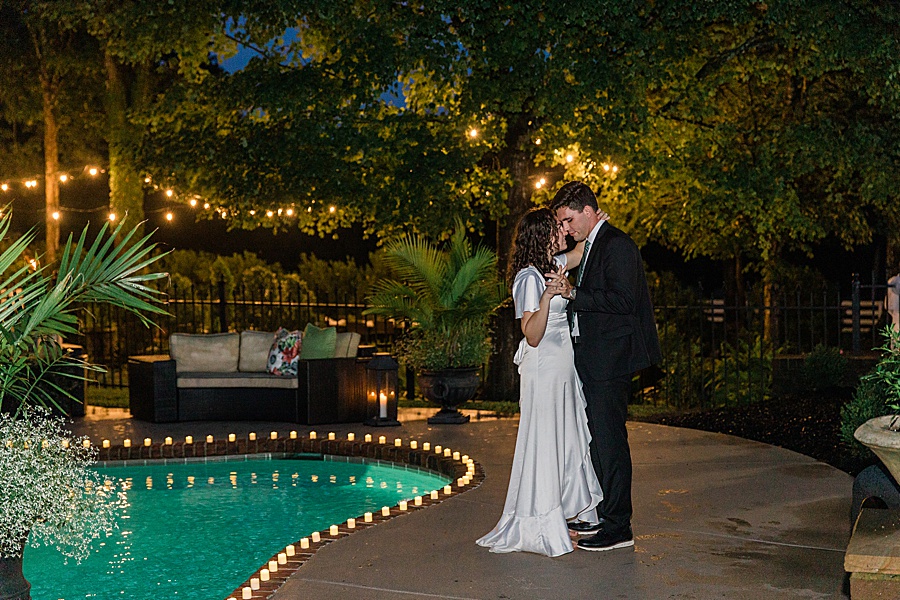 bride and groom first dance pool side