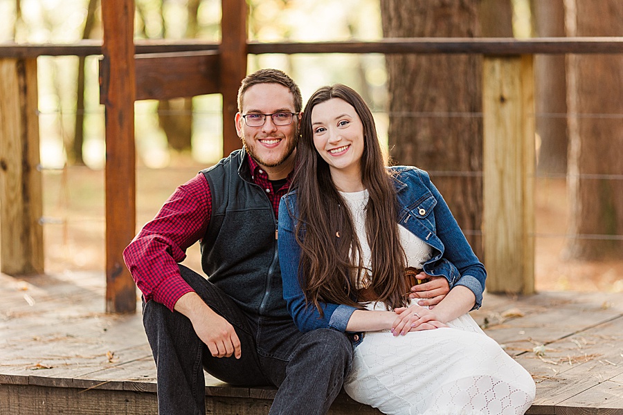 couple sitting on a wooden porch