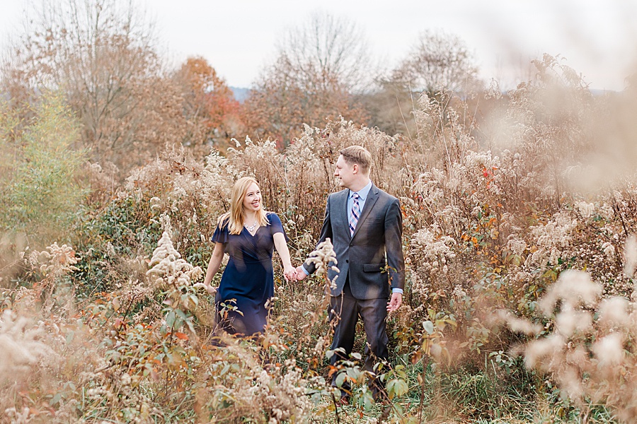 couple in fall color tall grasses
