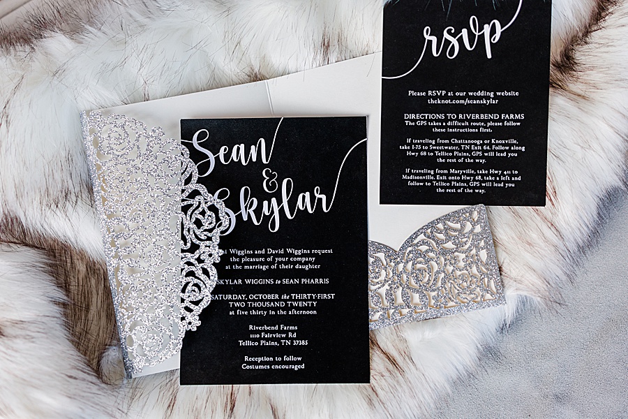 wedding invitation in black and silver on a fur wrap