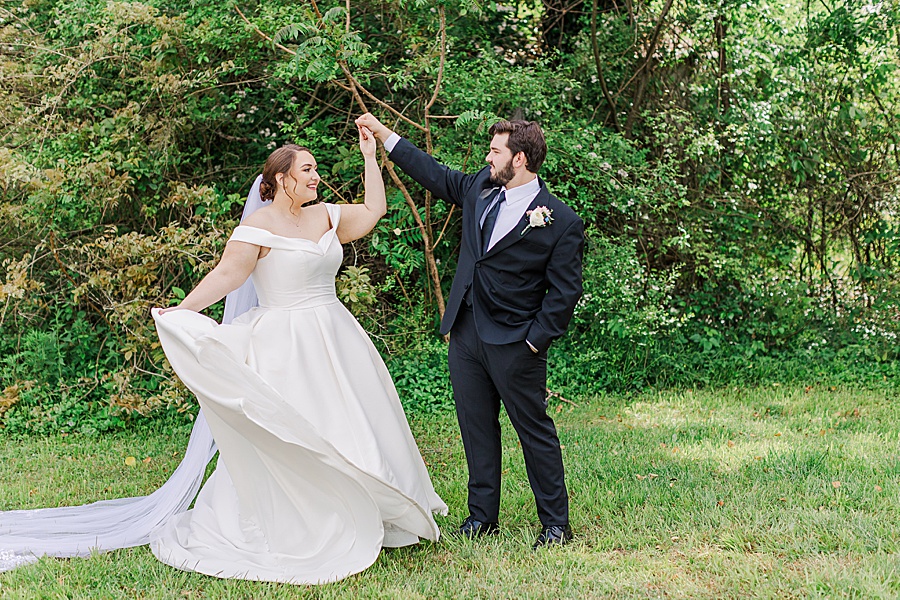 bride and groom twirling