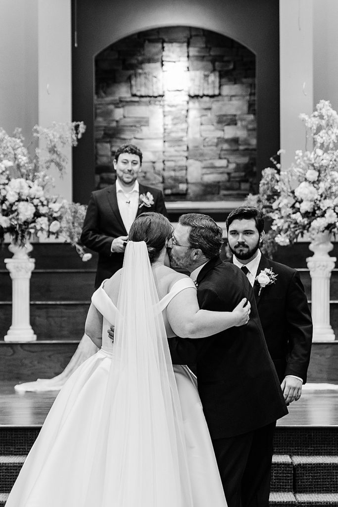 father giving away his daughter to his groom