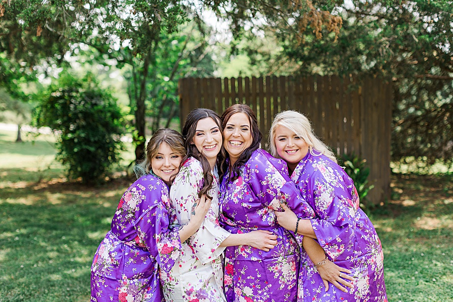 bride and bridesmaids in lavender robes