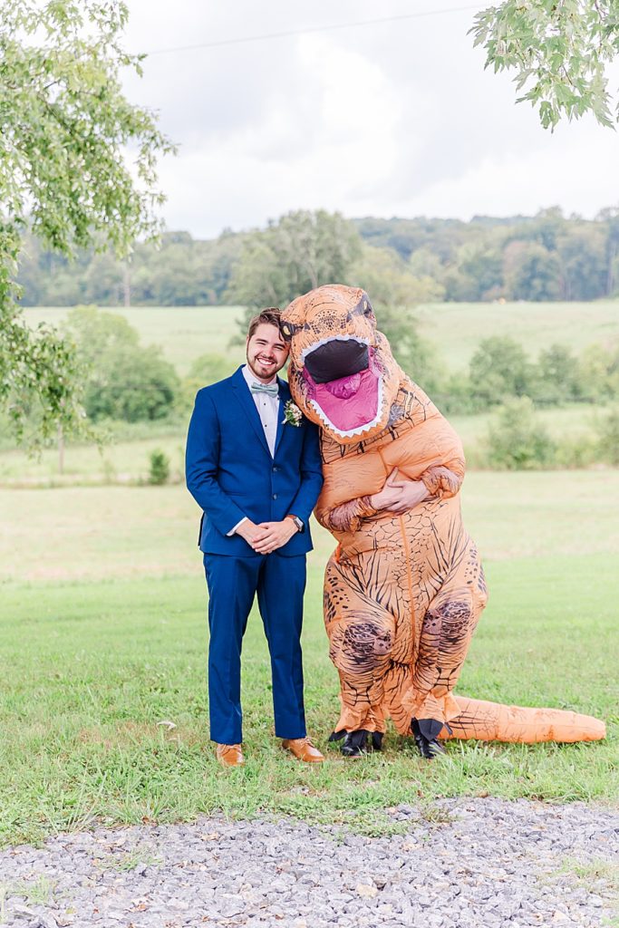 fake first look with dinosaur costume
