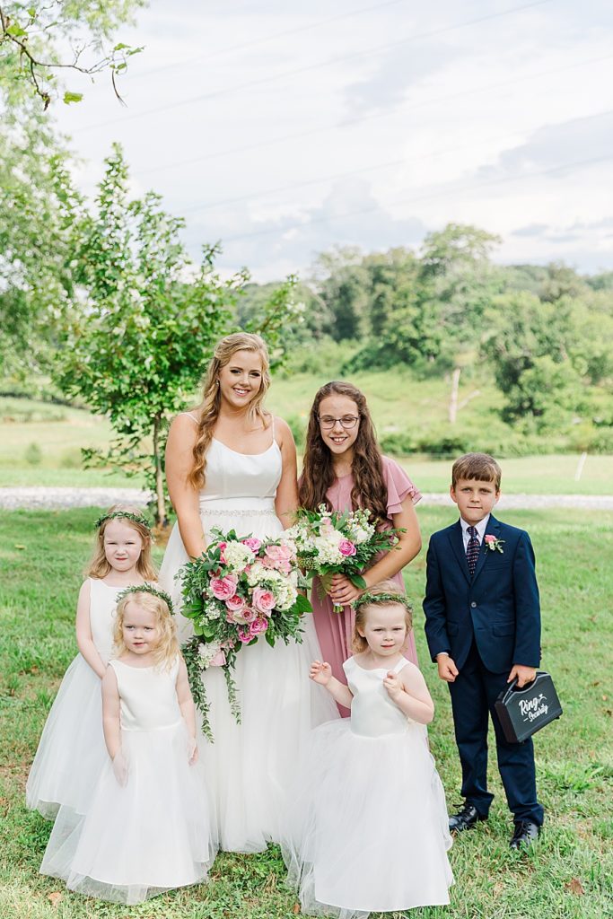 bride with flower girls and ring bearer
