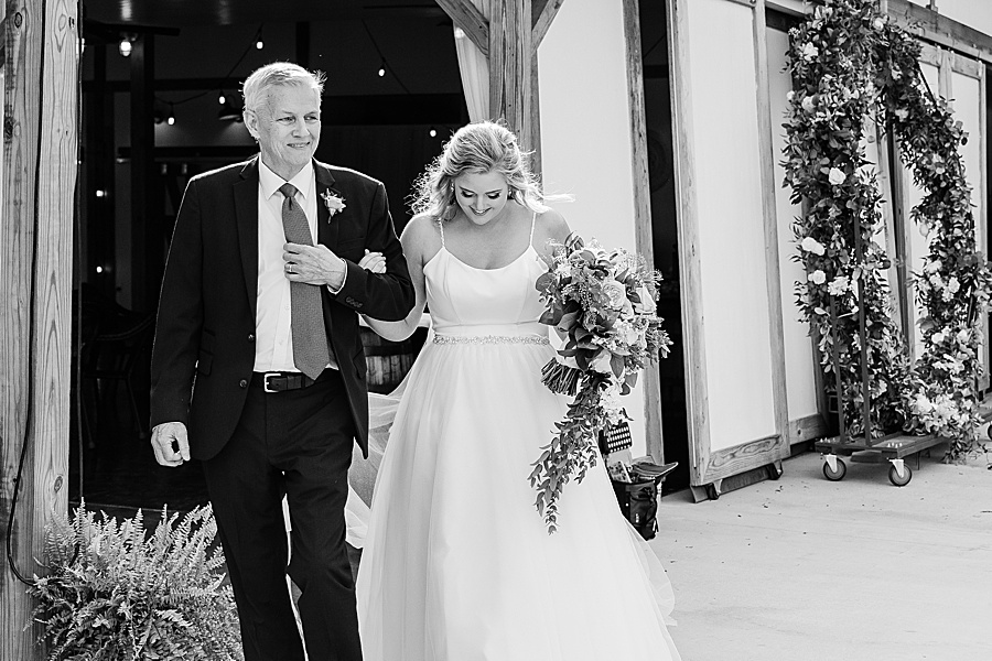 bride and father walking down the aisle