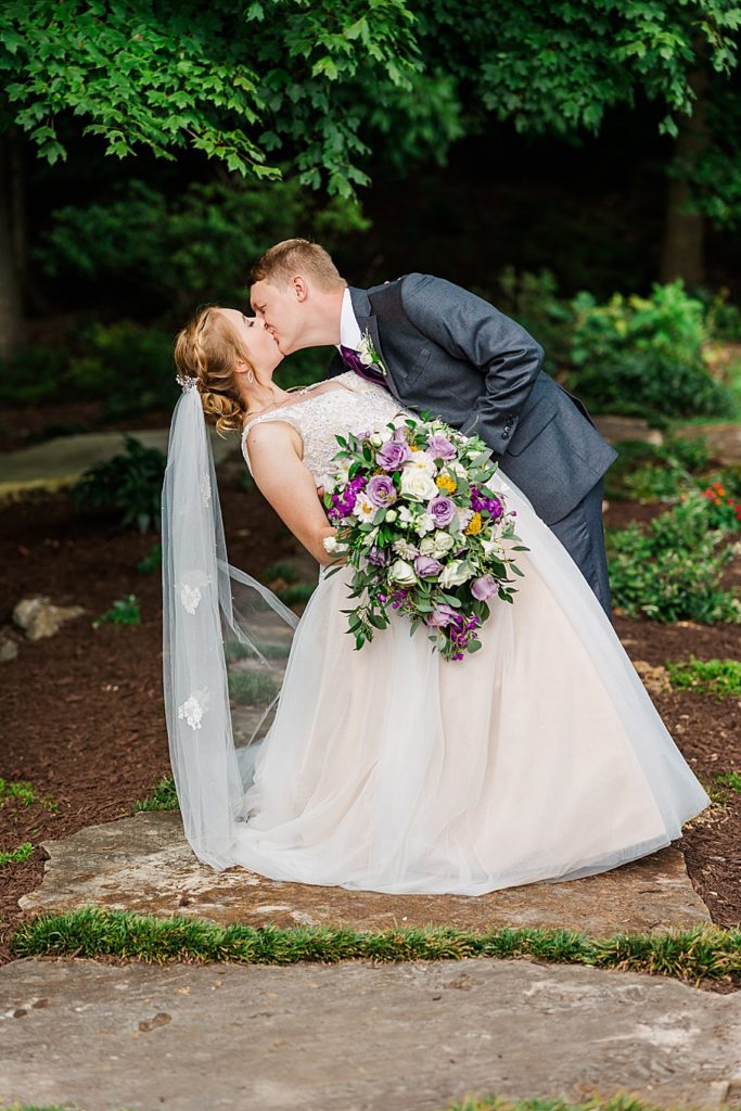 bride and groom dip kiss