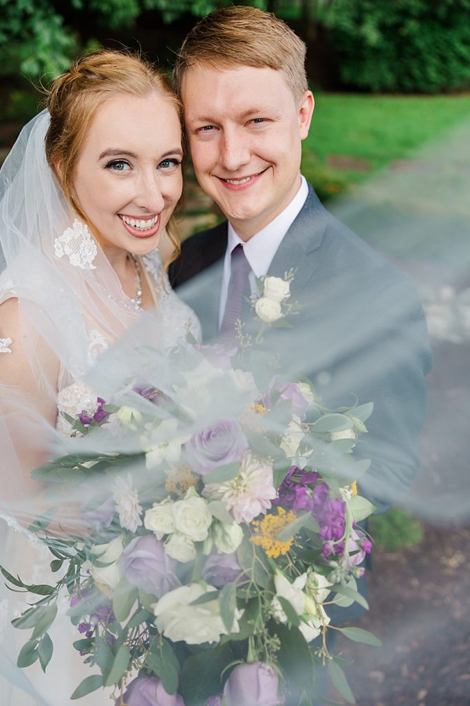 bride and groom veil swoop