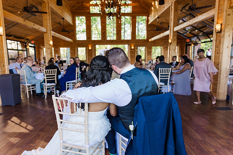 couple embracing at reception of mountain top wedding