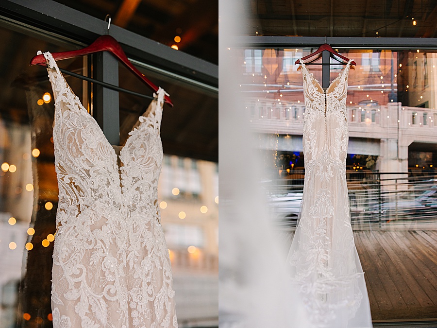 Lace bridal gown hanging in front of Jackson Terminal in Knoxville TN by Mandy Hart Photo, Knoxville TN Wedding Photographer