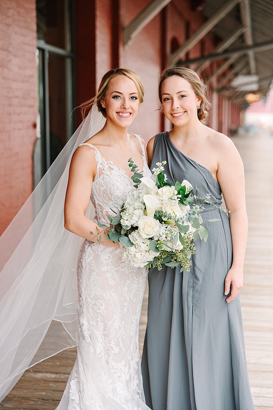 Bride and sister portrait at Jackson Terminal in Knoxville TN by Mandy Hart Photo, Knoxville TN Wedding Photographer
