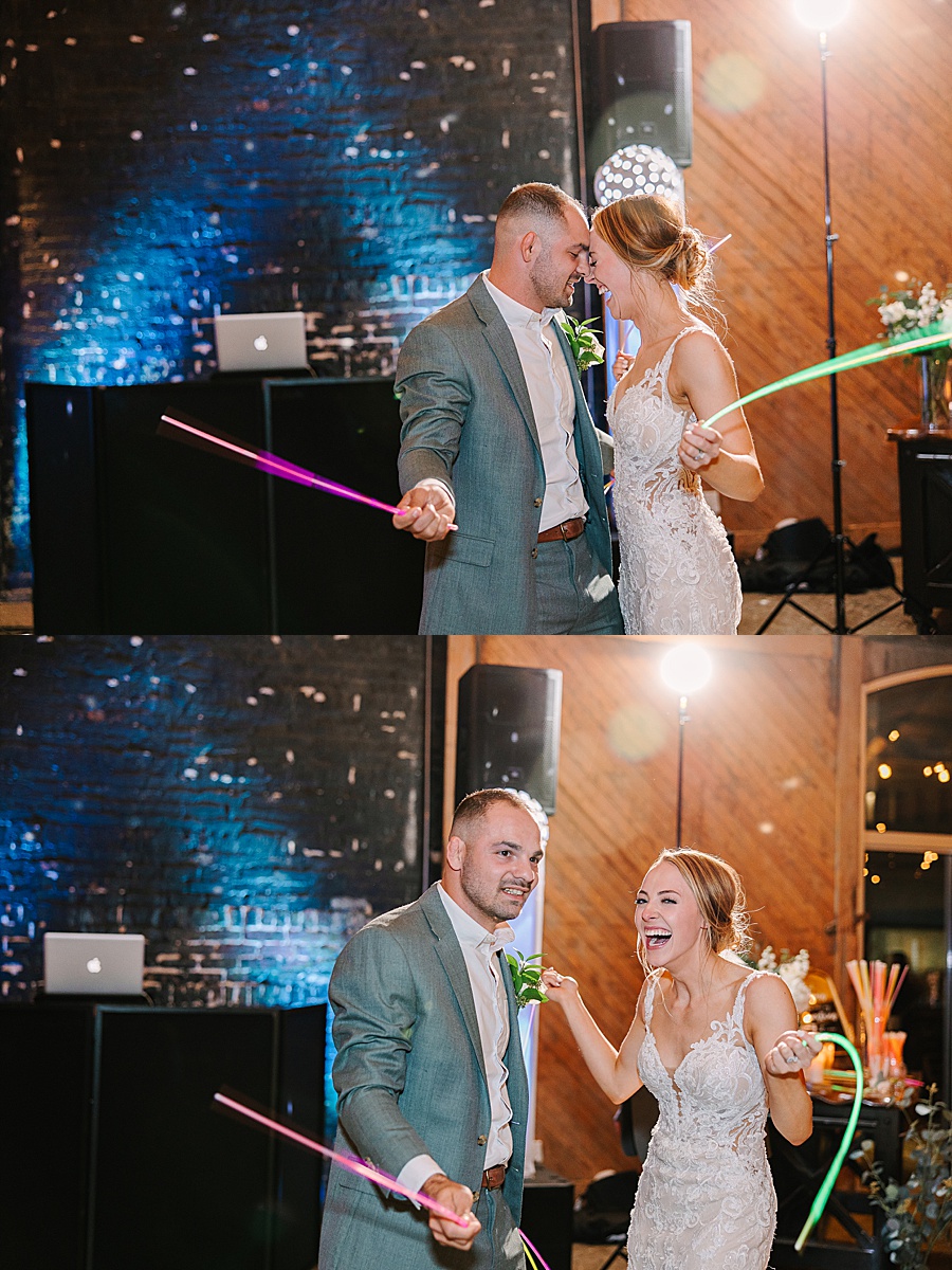 Bride & Groom dancing with glow sticks at reception at Jackson Terminal events wedding in Knoxville TN by Mandy Hart Photo, Knoxville TN Wedding Photographer
