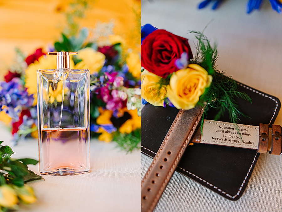 Perfume bottle, florals and watch and wallet at LGBTQ wedding at the Venue at Greenbrier Estate in east Tennessee by Mandy Hart Photo a Knoxville, TN wedding photographer