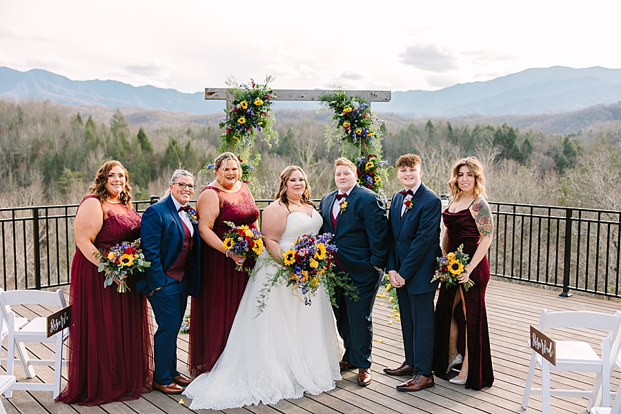 bridal party in front of arbor over looking smoky mountains at LGBTQ wedding at Venue at Greenbrier Estate by Mandy Hart Photo Knoxville Wedding photographer