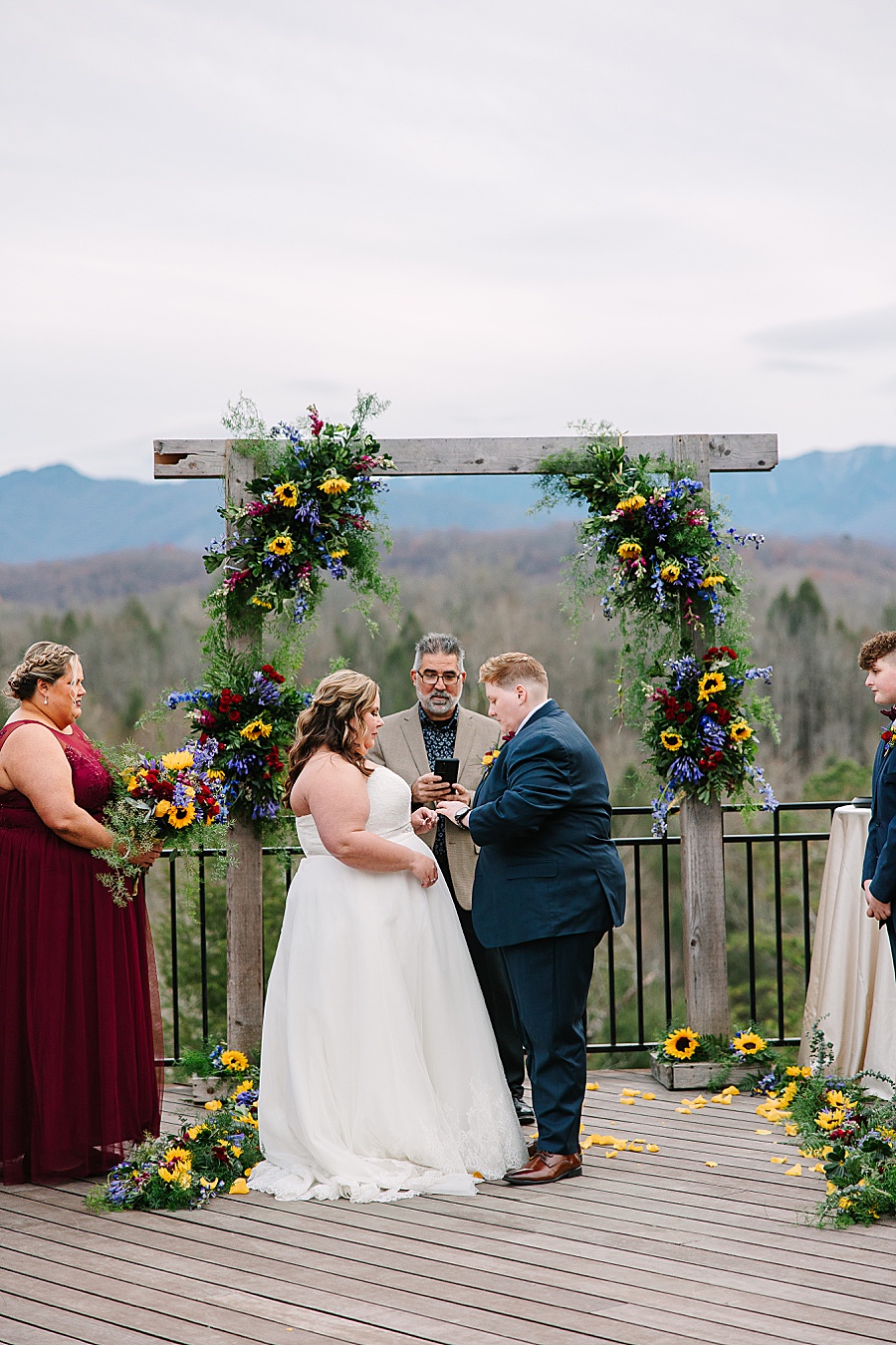 exchanging of rings at alter during wedding at Venue at Greenbrier Estate by Mandy Hart Photo Knoxville Wedding photographer