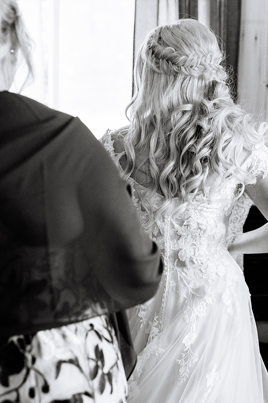 black and white photo of back of bridal gown