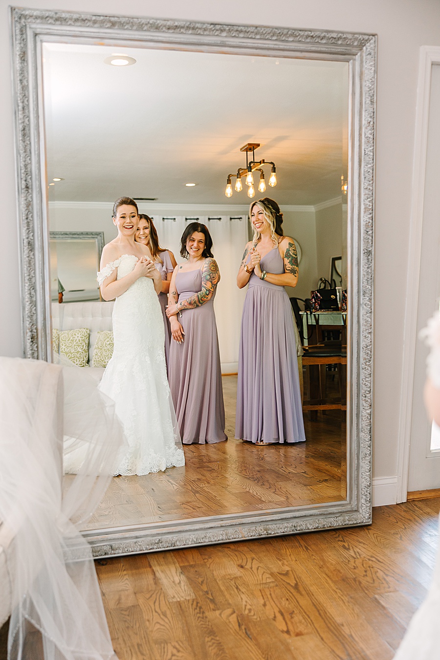 Bride seeing herself in her wedding dress for the first time