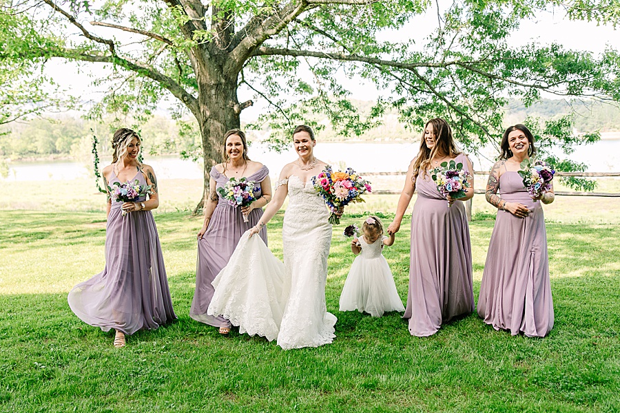 Bride walking with Bridesmaids on wedding day