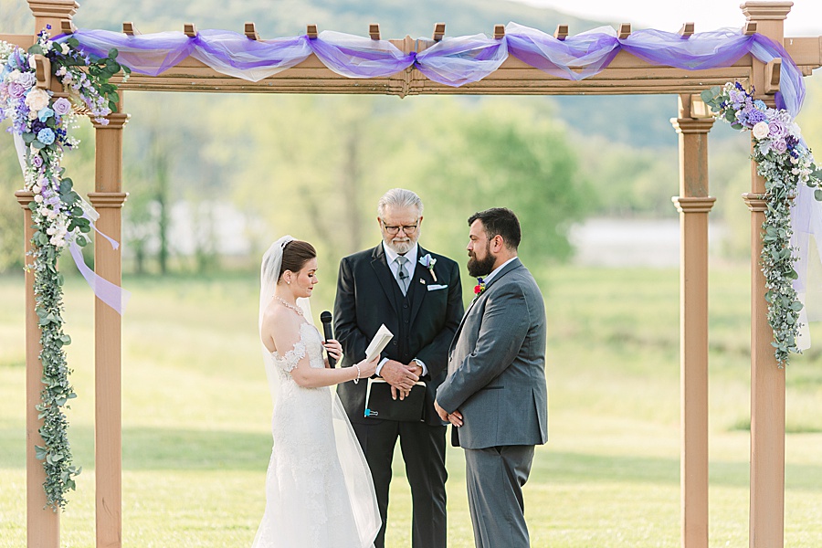 bride reading vows during wedding ceremony