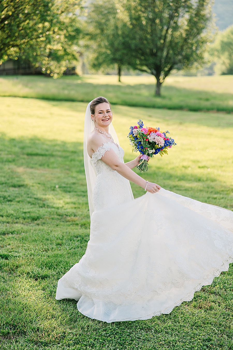 bride twirling with vibrant floral bouquet