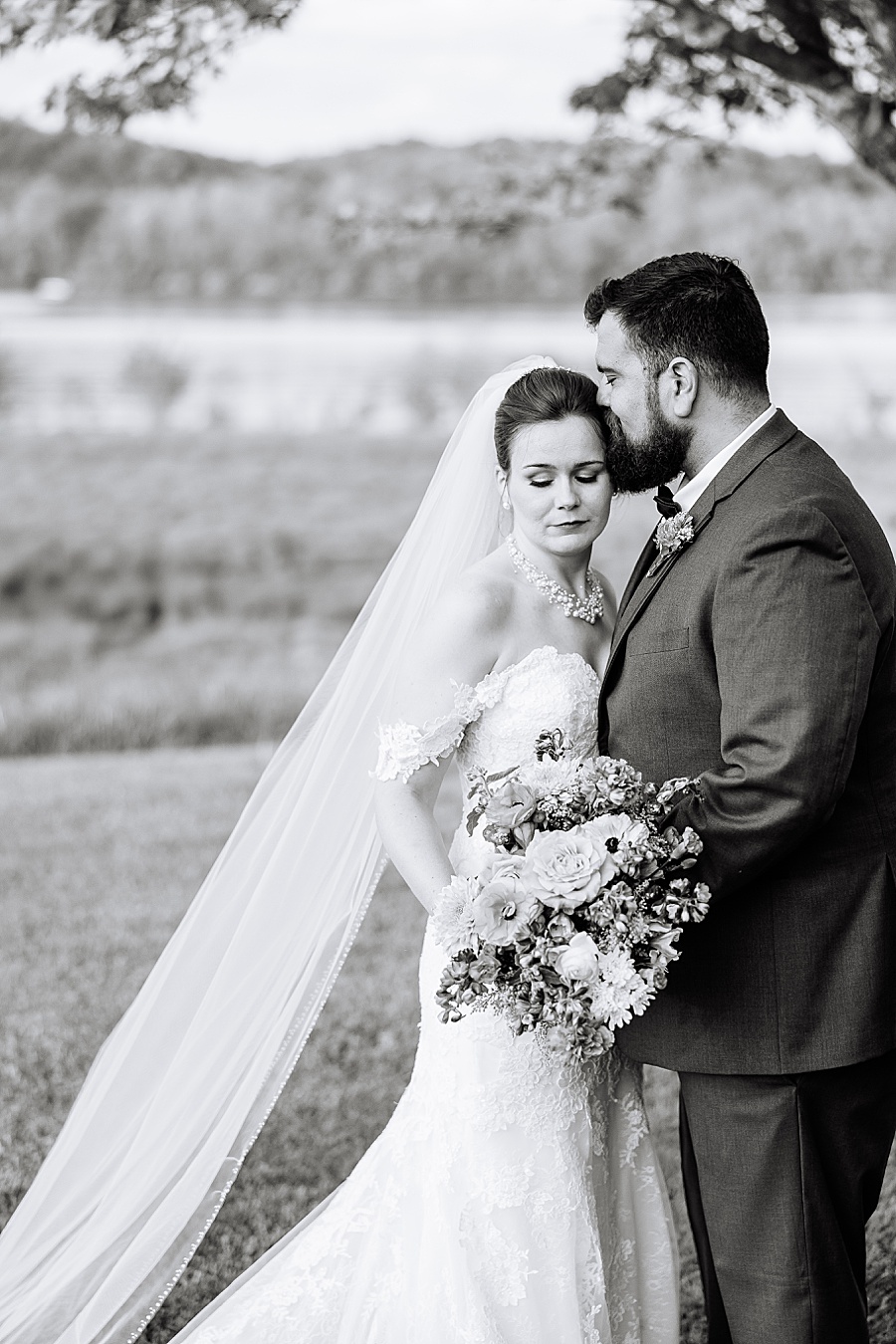 black and white portrait of bride and groom at river front in Chattanooga wedding