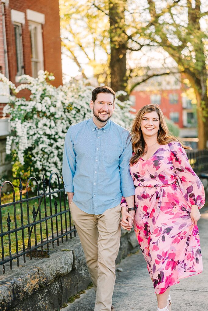 couple walking through downtown chattanooga during their engagement session 
