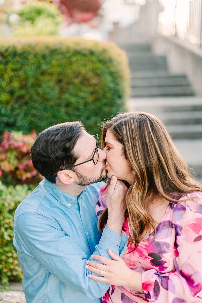 couple kissing in a park during their downtown chattanooga engagement session
