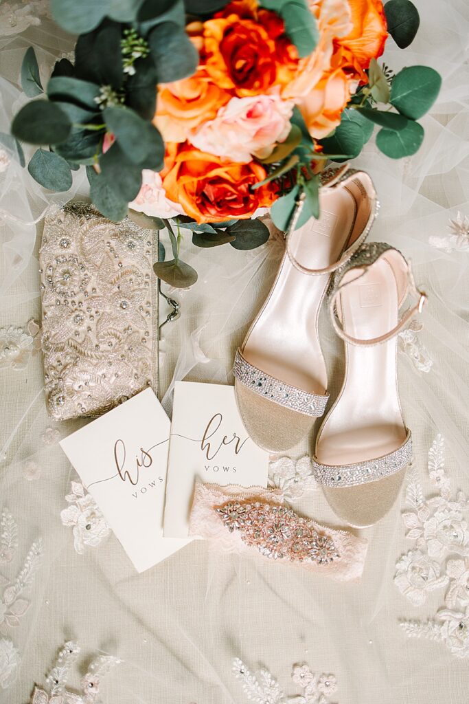 Bridal details such as vow books and bridal shoes
