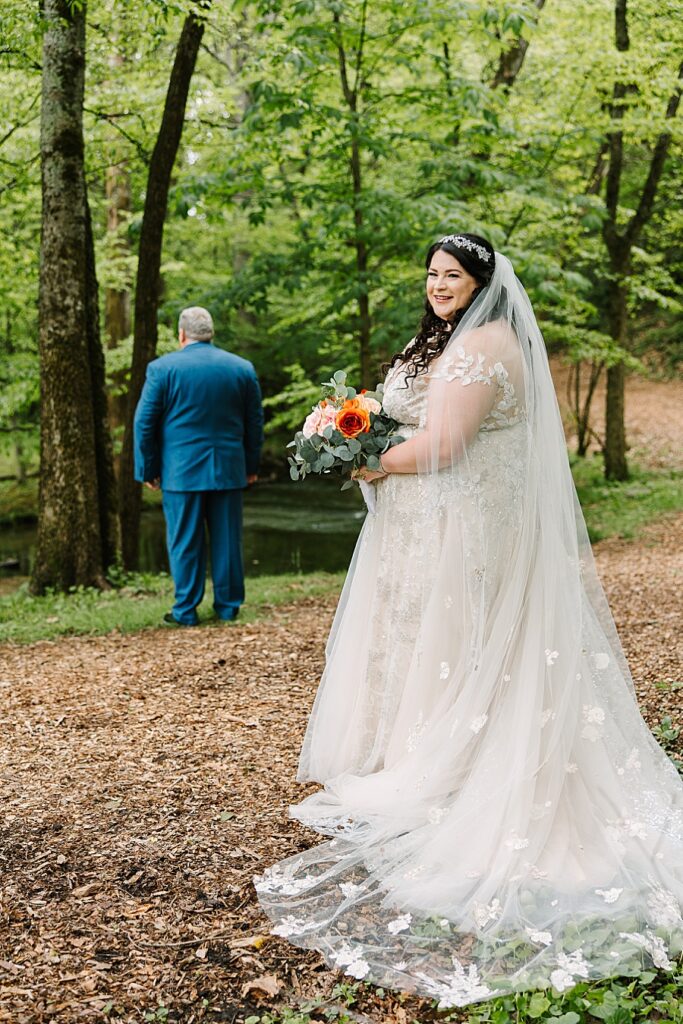 bride waiting for a first look with her dad