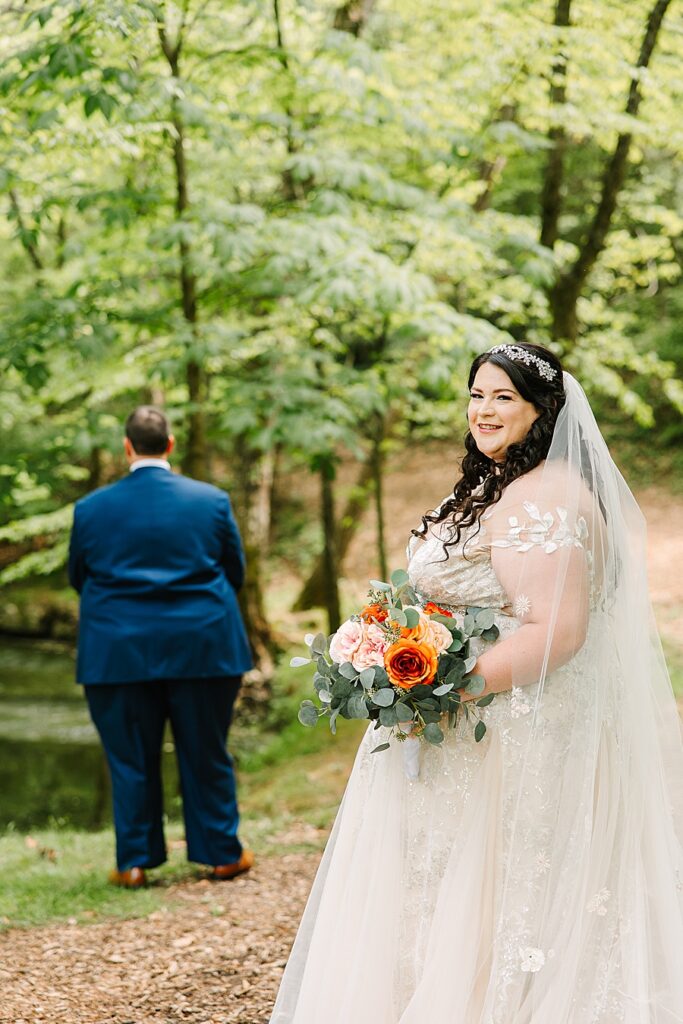 bride waiting for a first look with her groom