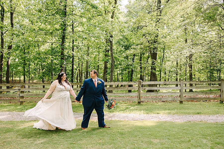 Bride and groom walking outside of Riverview Farms Wedding 