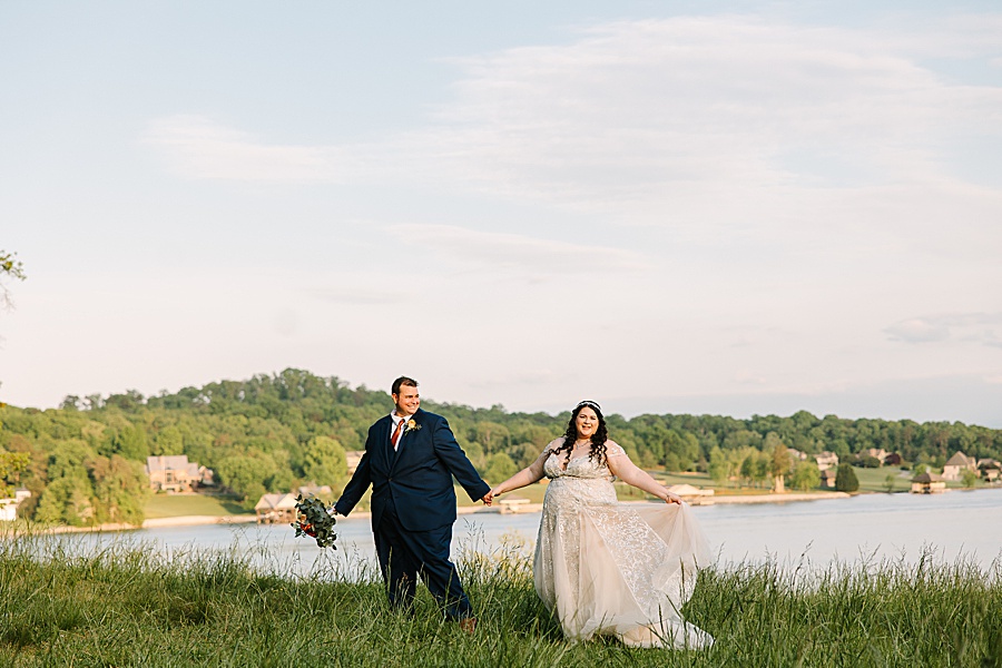 bride and groom walking along the Tennessee River at Riverview Farms wedding