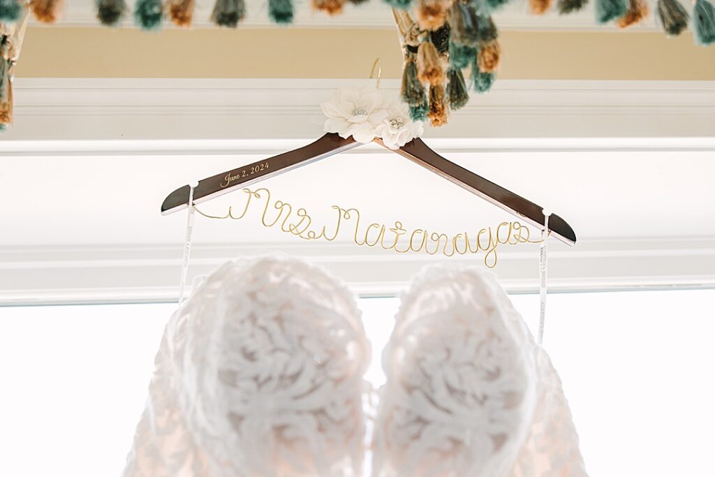 wedding dress hanging on custom bride hanger