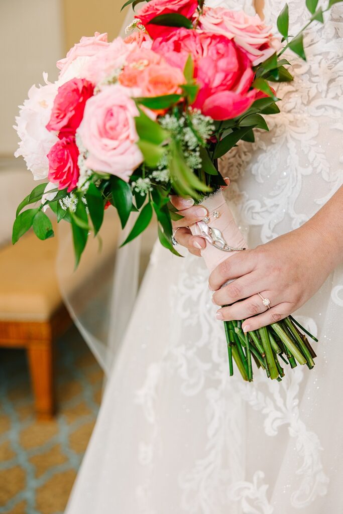 bridal bouquet with grandmothers broach pinned on stems