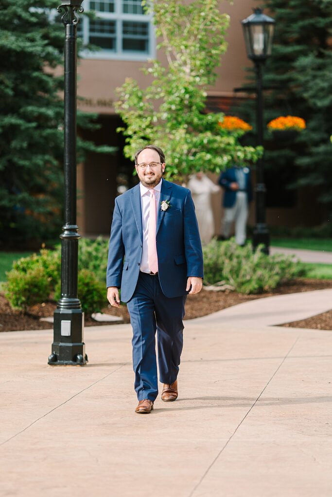 groom walking out to his wedding at the broadmoor resort