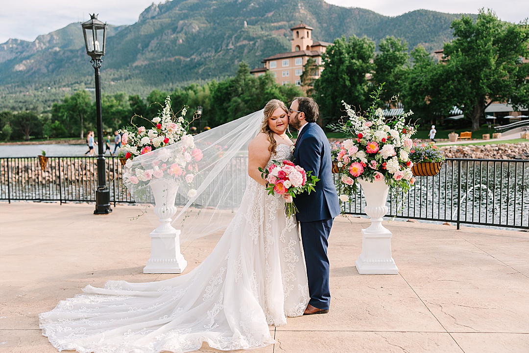 bride and groom at lake front wedding at Broadmoor Resort in Colorado Springs