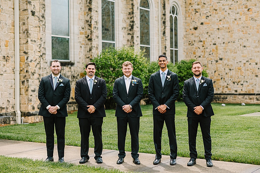 groom and groomsmen outside of church