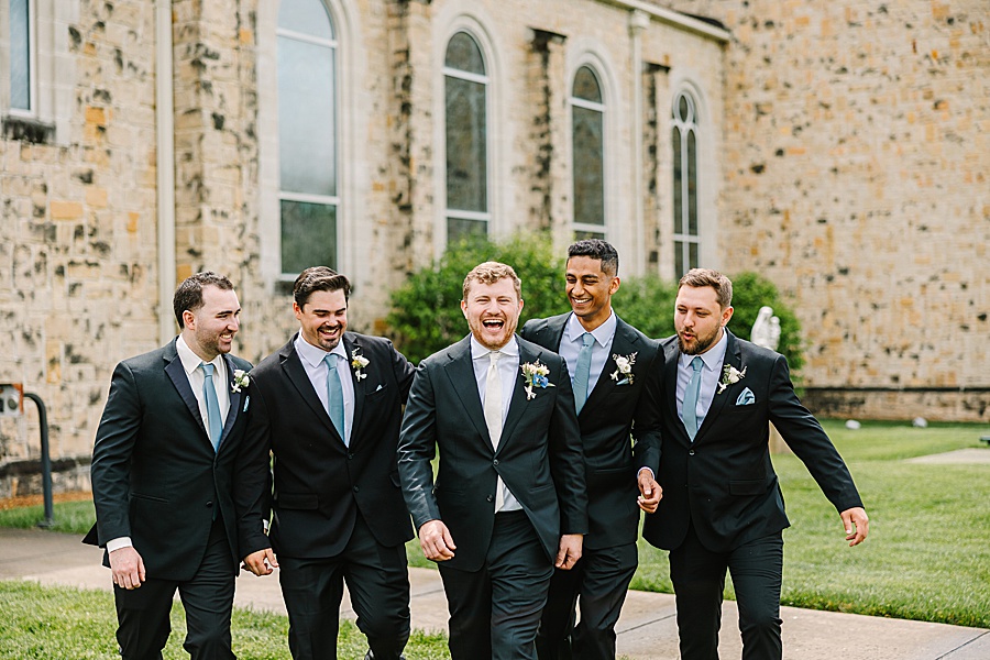 groomsmen cheering on the groom before the wedding
