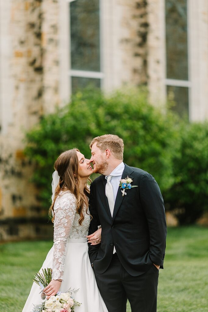 bride and groom sharing intimate moment after wedding