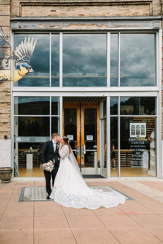 bride and groom outside of reception venue