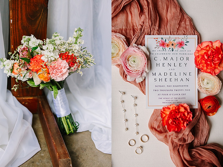 bridal bouquet of pinks and corals and wedding invitation with florals and pearl earrings