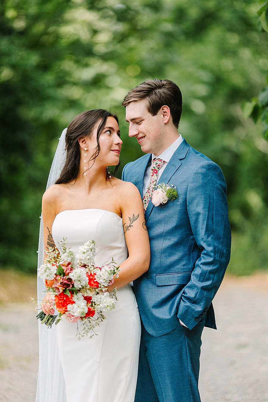 Bride and groom embracing on wedding day at venue at the bluffs