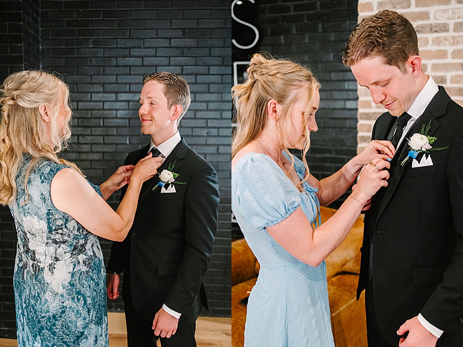 mom of groom adjusting groom's tie, sister of groom pinning on boutonniere.