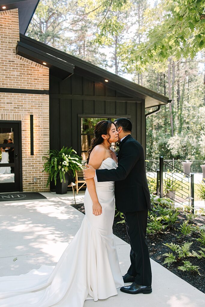 Dad embracing daughter on wedding day