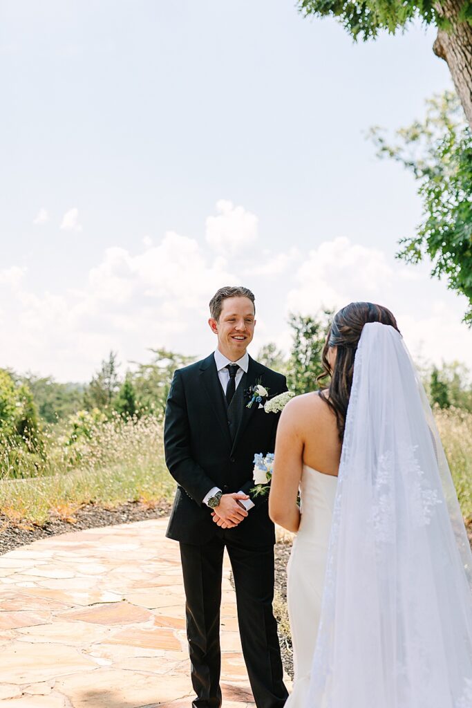 groom seeing bride for first time on wedding day at Nichols Heir in Sevierville TN