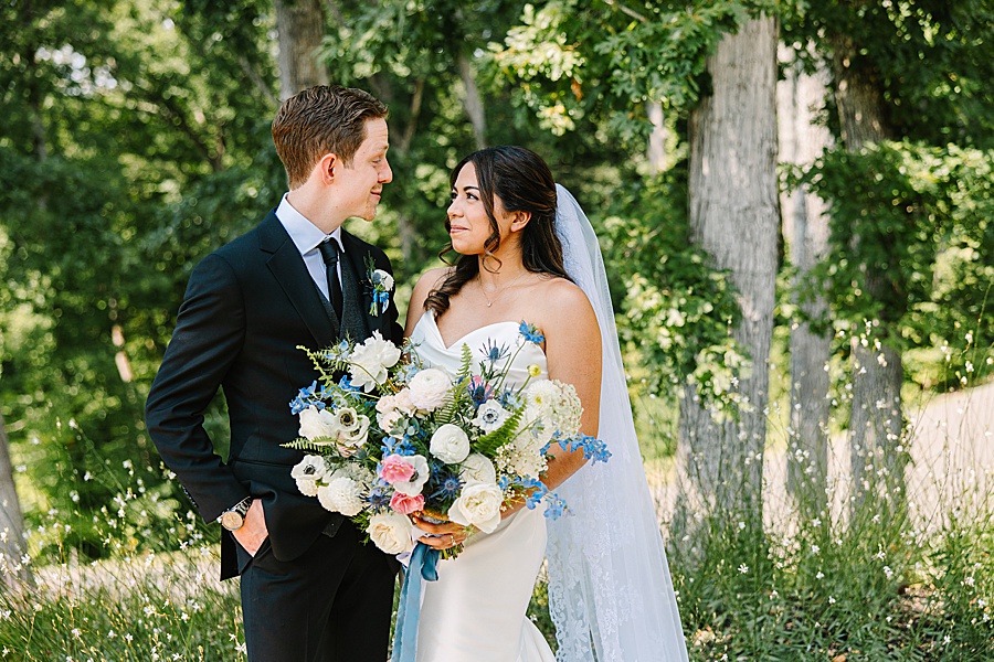 bride and groom with bouquet of lush floral design by Valley Flowers in Chattanooga TN