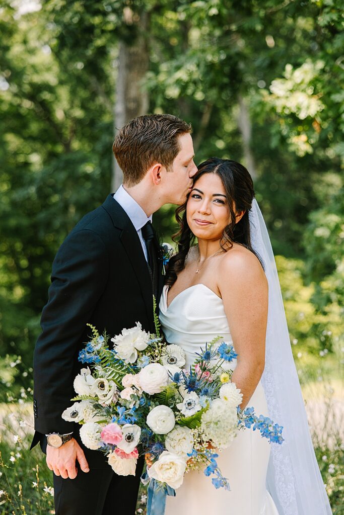 bride and groom with bouquet of lush floral design by Valley Flowers in Chattanooga TN