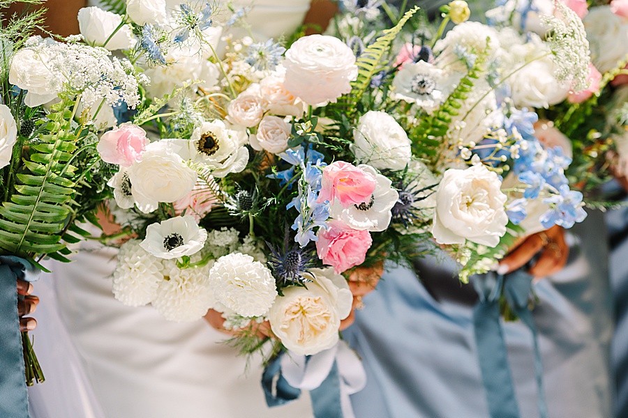 lush bridal bouquets by Valley Flowers in Chattanooga featuring garden roses, pink lisianthus, delphinium, white poppies