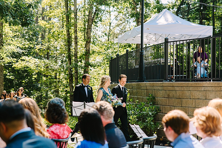 groom walking mom to ceremony