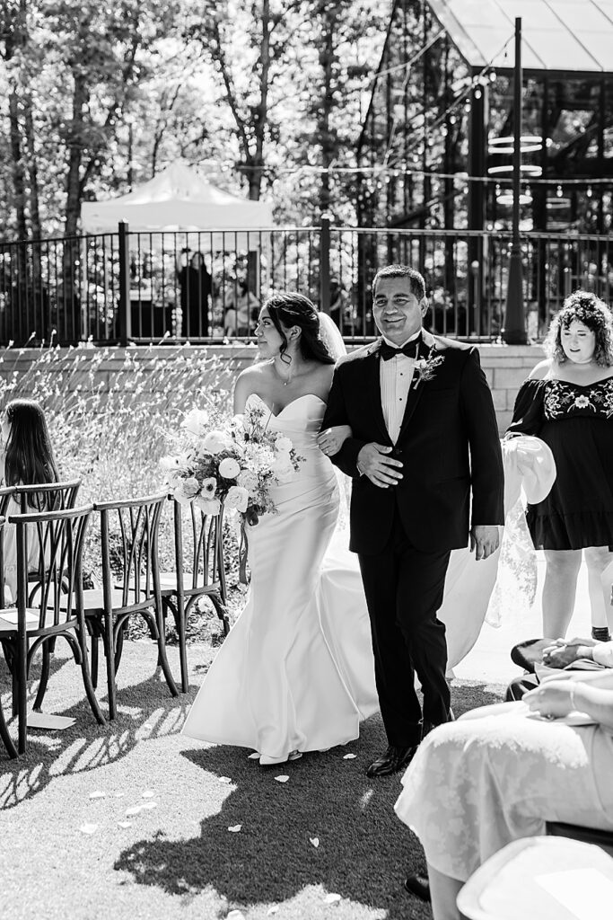 dad walking bride down aisle at the Glass House at Nichols Heir